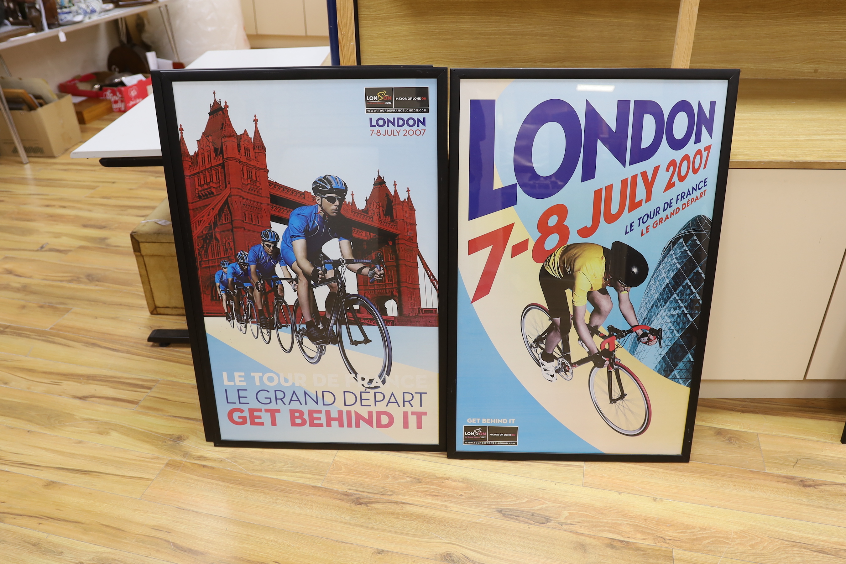 A set of four Tour De France posters, framed